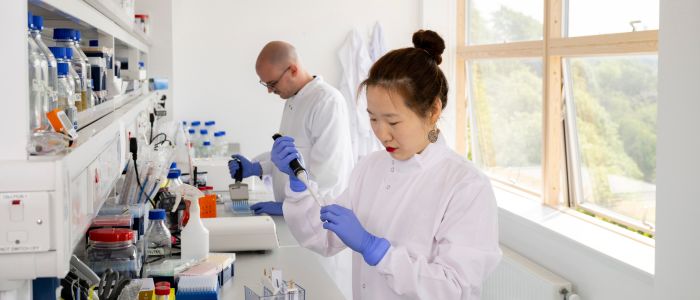 Two researchers in a lab in the British Heart Foundation Centre for Research Excellence facility