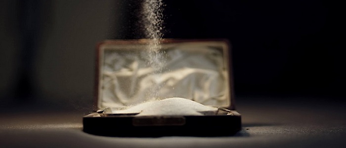 An image of salt being poured into a dish. The image is used for the Common Salt performances, workshop and sympoisum at the University of Glasgow 
