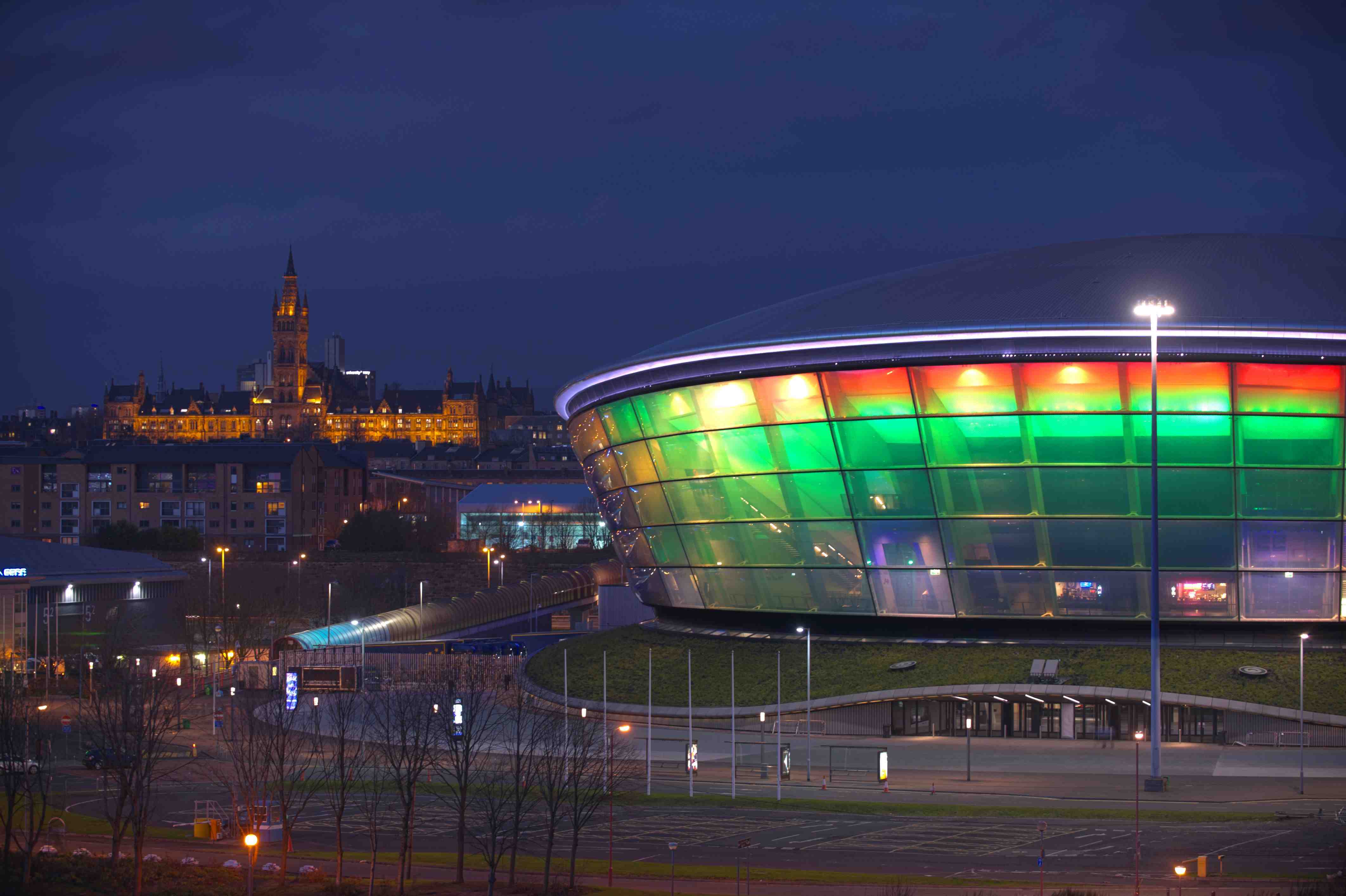 Ovo Hydro building with University in background at night