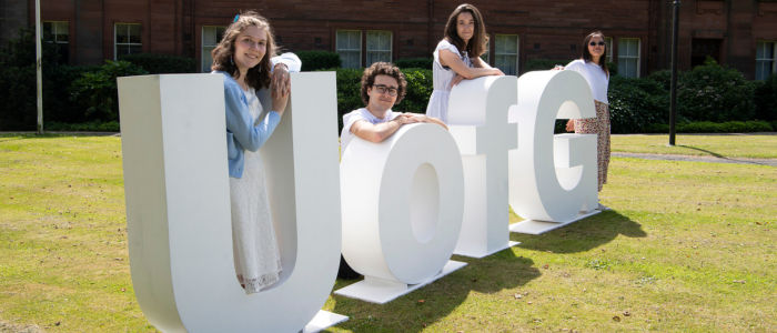 Students with UofG letters on campus