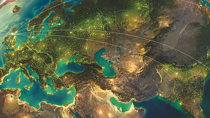 Graphic of Earth from space with lines between places to represent global connection