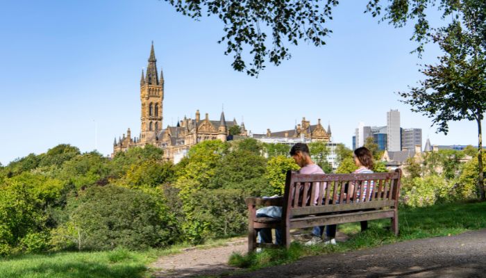Students sitting on a bench n Kelvingrove park
