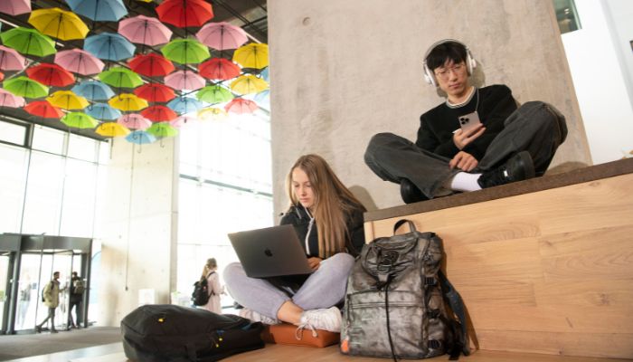Students studying in the ground floor of the JMS building