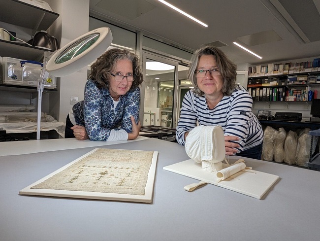 Sarah Foskett (left) and Karen Thompson (right) of the Kelvin Centre for Conservation Research and Cultural Heritage examine some of the restored artefacts. Credit OneRen Karen Thompson and Sarah Foskett of the Kelvin Centre for Conservation Research and Cultural Heritage examine some of the restored artefacts