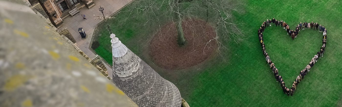Aerial photo of the East Quadrangle, with students grouped in the shape of a heart.