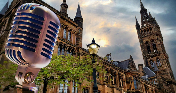 Vintage microphone in front of old college.
