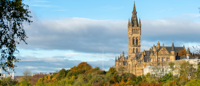Photograph of Glasgow University over trees 
