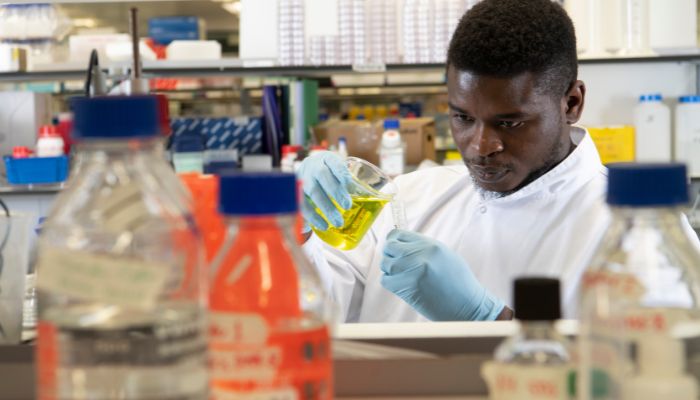 International student conducting research at the Wolfson Wohl Cancer Sciences lab