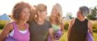 A group of four mature women chatting and walking