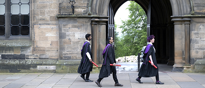 Students graduating Gilbert Scott 