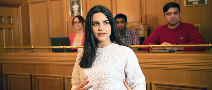 Student in Moot Court room School of Law