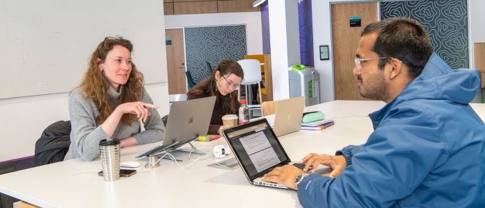 Group of people chatting in the Clarice Pears Building