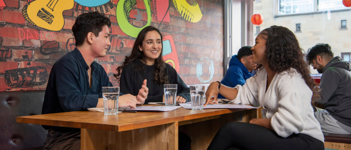 Students sitting at table in Stevenson Building