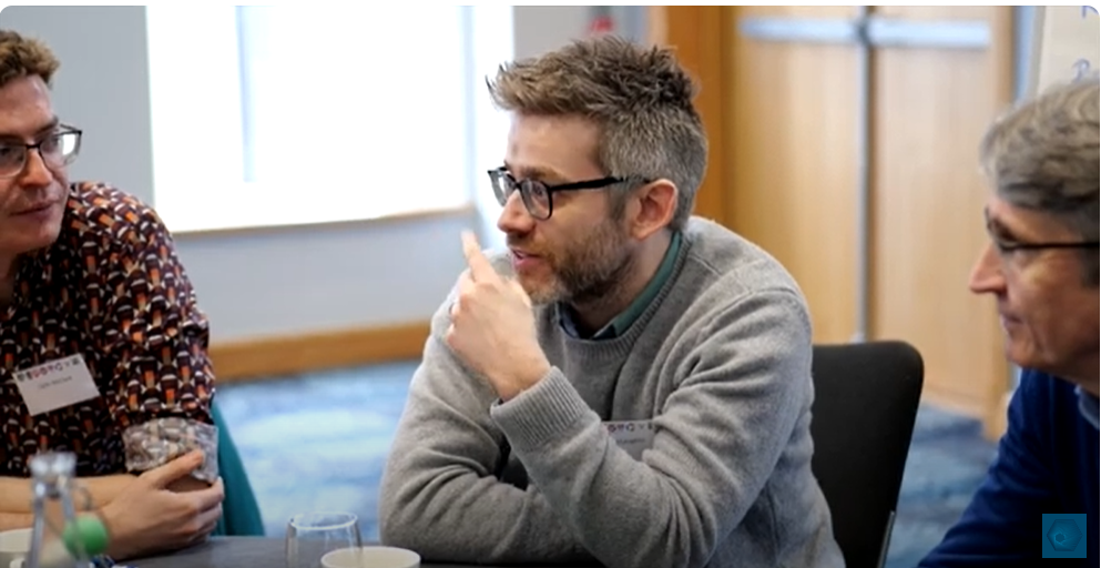 One man sitting chatting