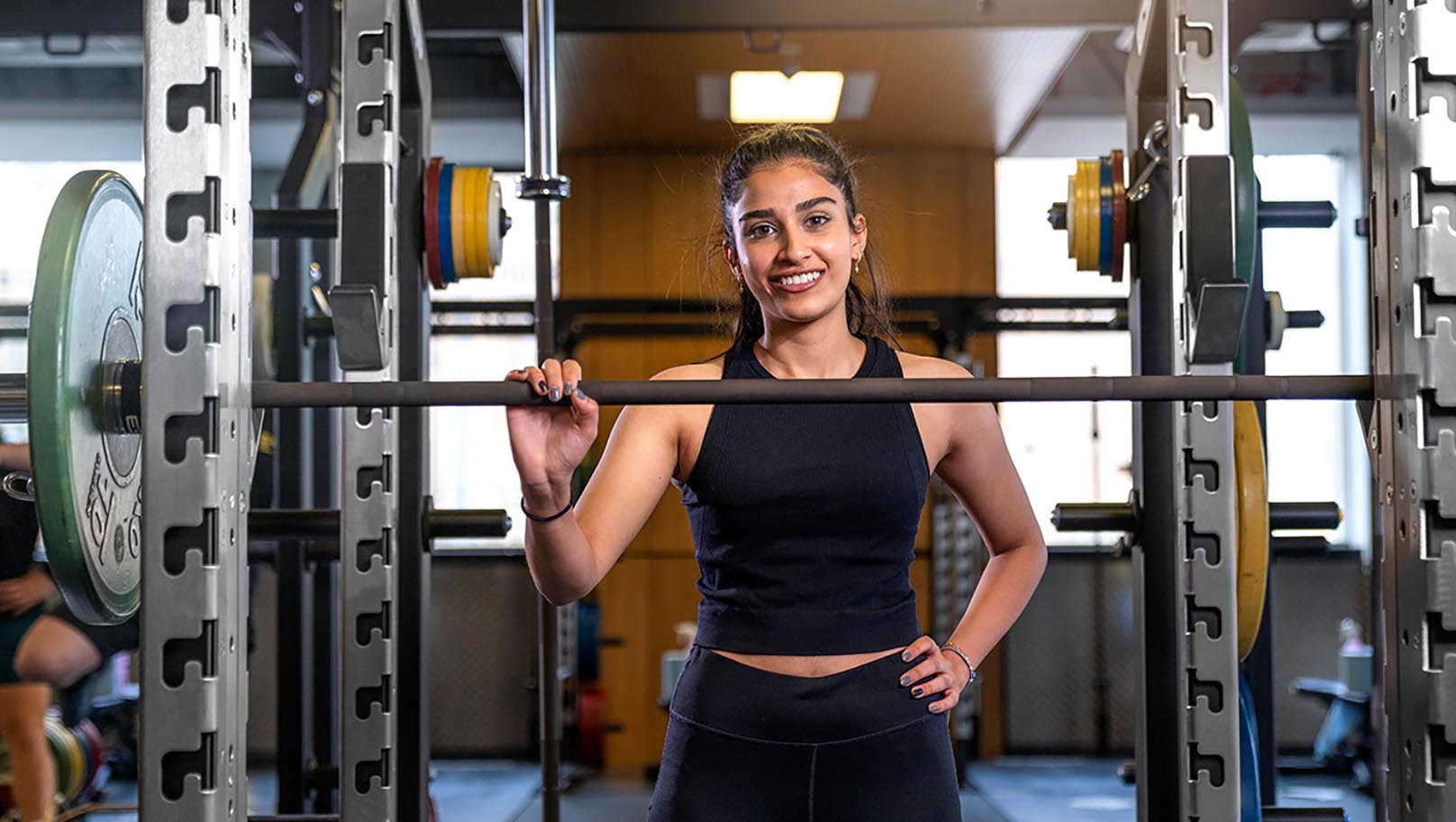 student standing on lifting platform in PowerPlay, the UofG Sport strength & conditioning zone