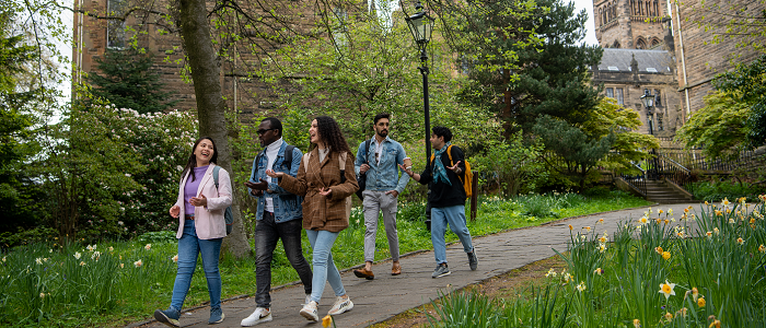 Students walking through park