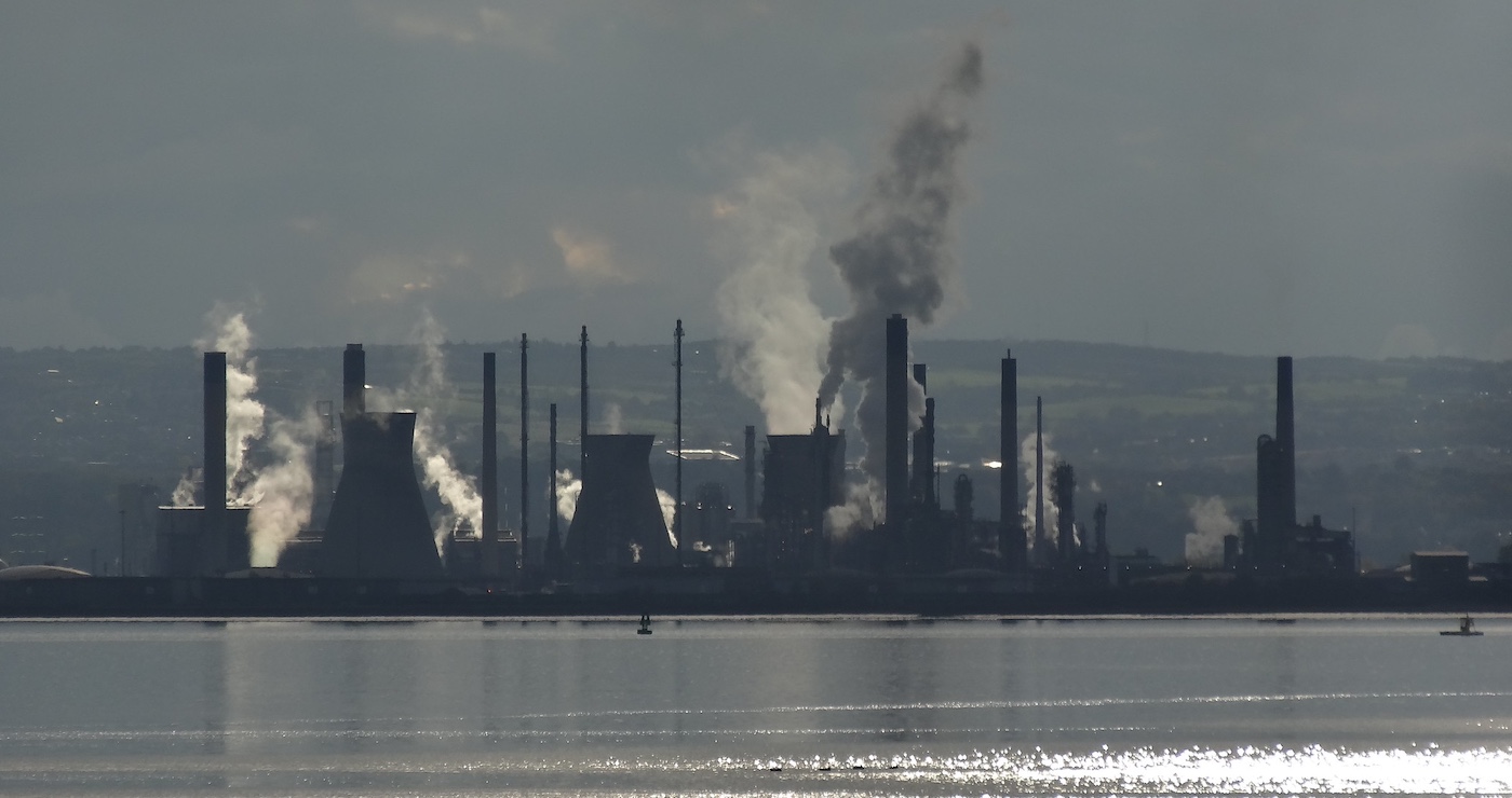 View of Grangemouth oil refinery across the Firth of Forth with smoke and steam coming from lots of different chimneys. Photo credit: Anne Ward, Flickr https://www.flickr.com/photos/ilike/18962645435/