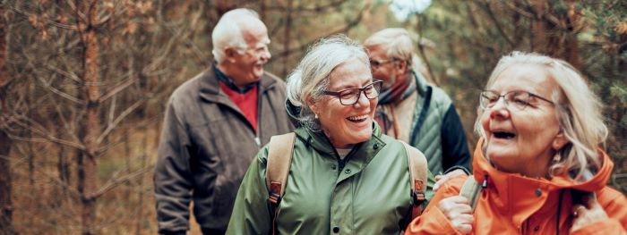 A group of older people walking outdoors