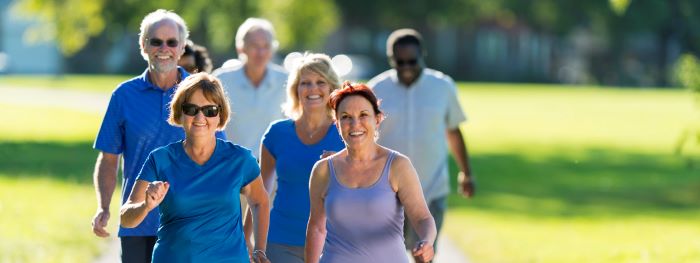 A group of people walking outdoors