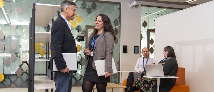 colleagues chatting in an office setting