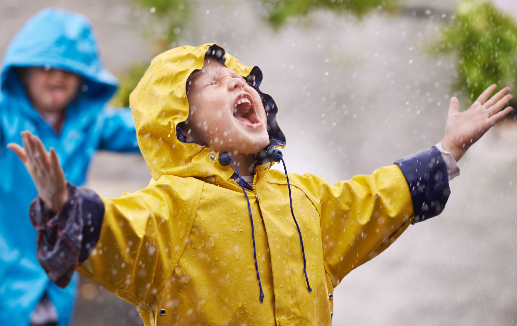Child having fun in the rain