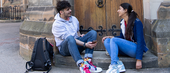 Two students chatting on campus
