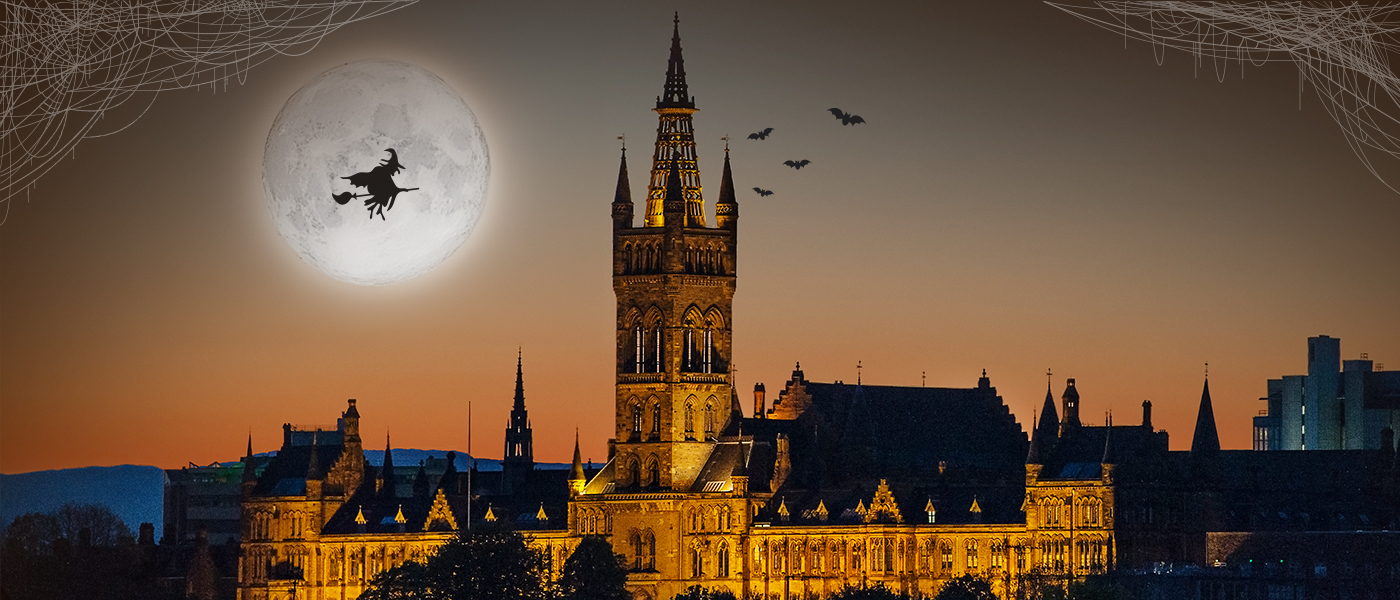 Halloween image of the Tower, with bats and a witch on a broomstick