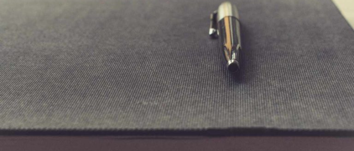 Stock image of pen and book