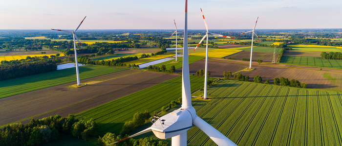 Aerial view of wind turbines in fields