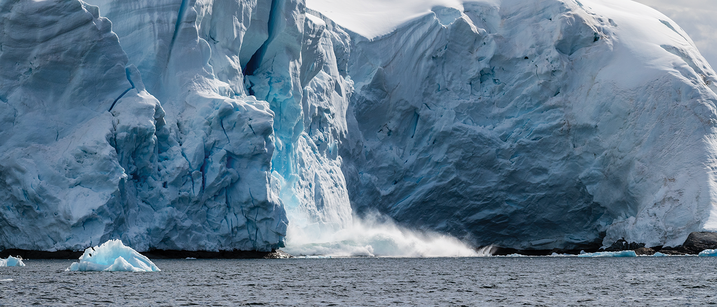 glacier calving into sea