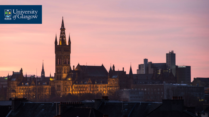 The Gilbert Scott Building in front of a pink sky