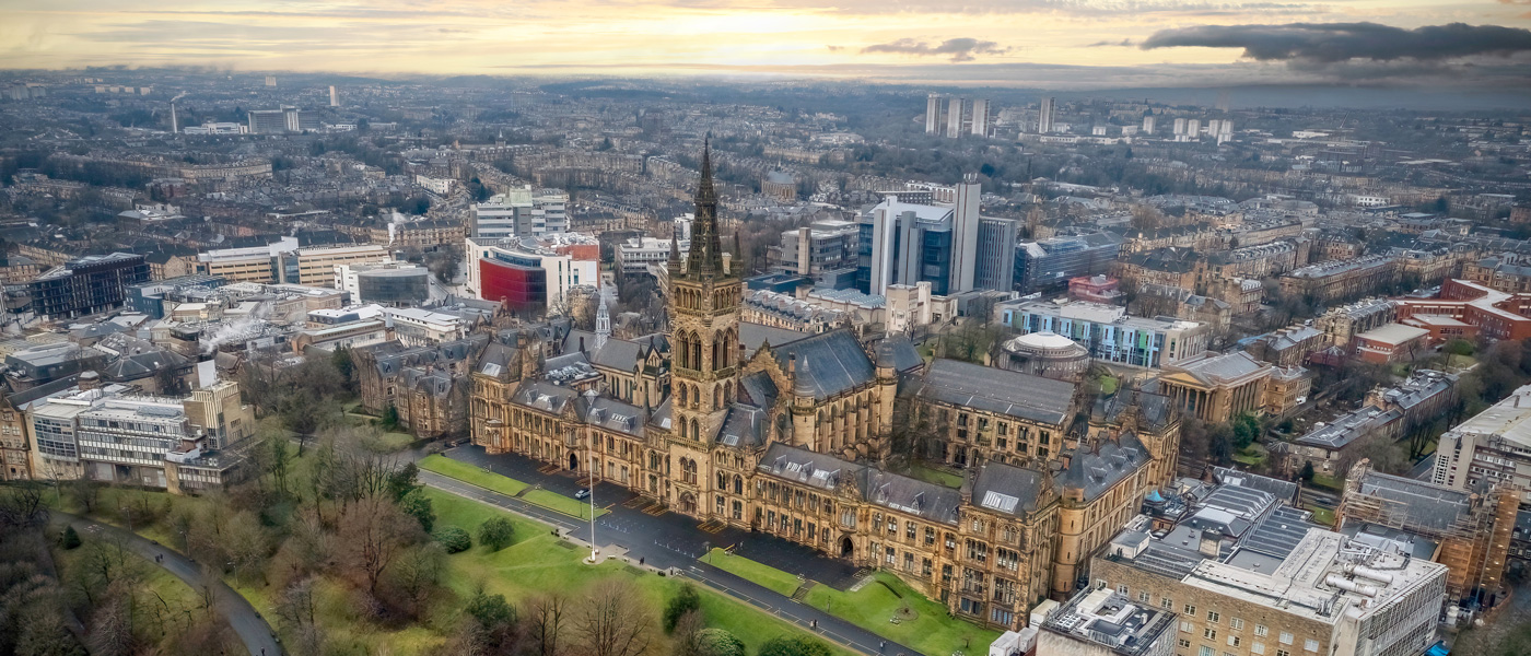 The university of glasgow gilbert scott building taking from a drone