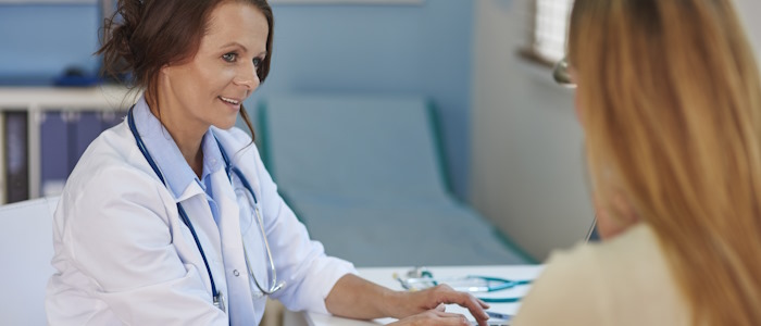 Image of a female GP talking to a female patient, image for illustrative purposes.