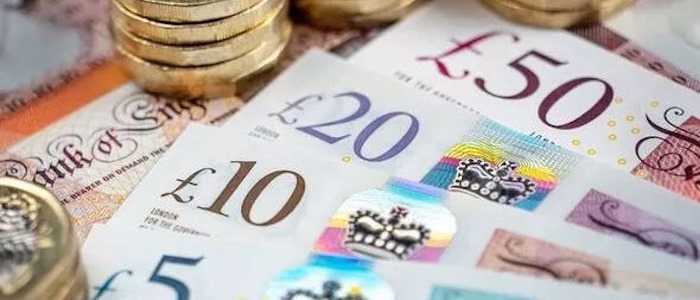 Image of paper and coin money for illustrative purposes.