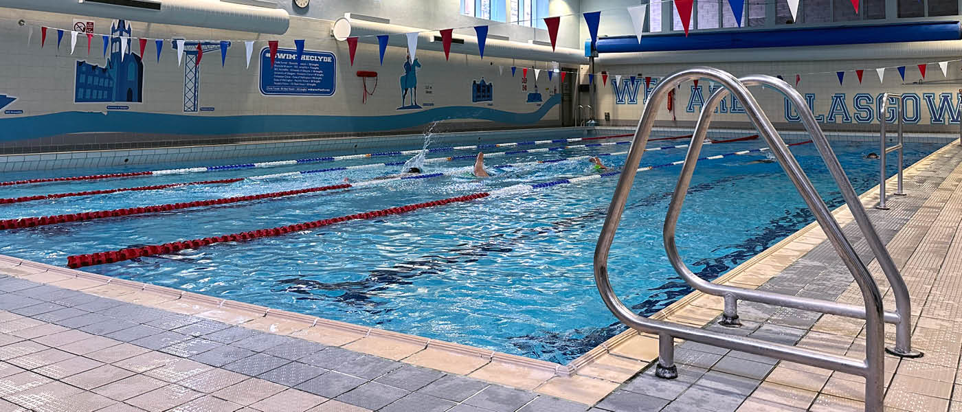 Image of the pool at UofG Sport showing ladders into water.