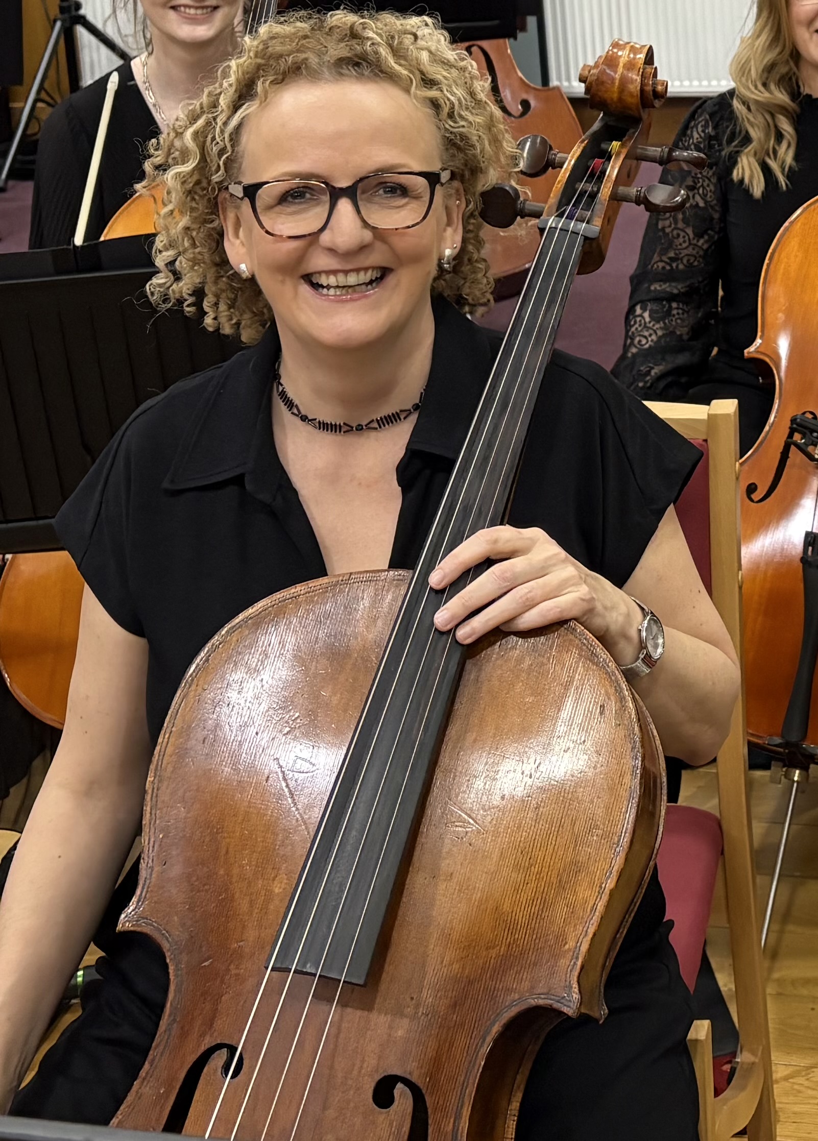Aileen sitting with cello