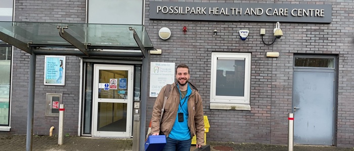 Male doctor standing outside Possilpark health and care centre
