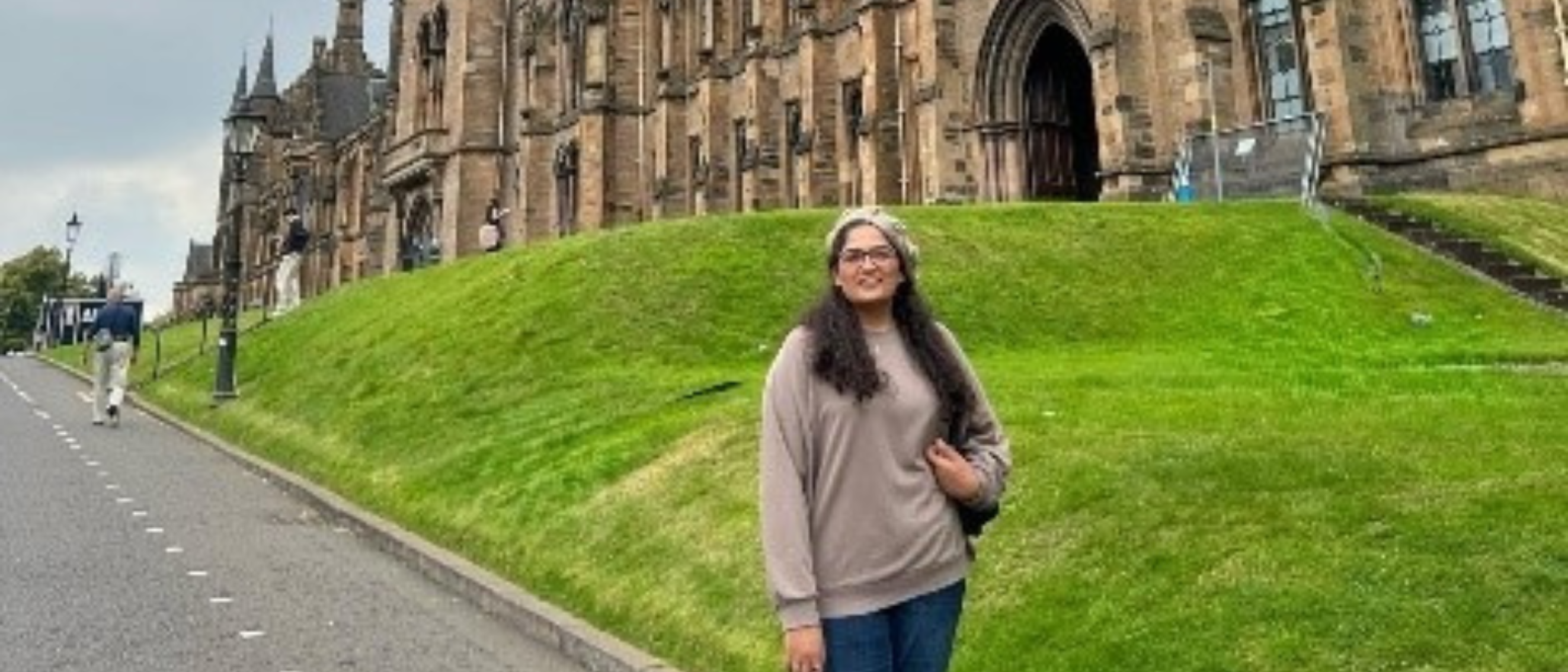 Student in front of uni