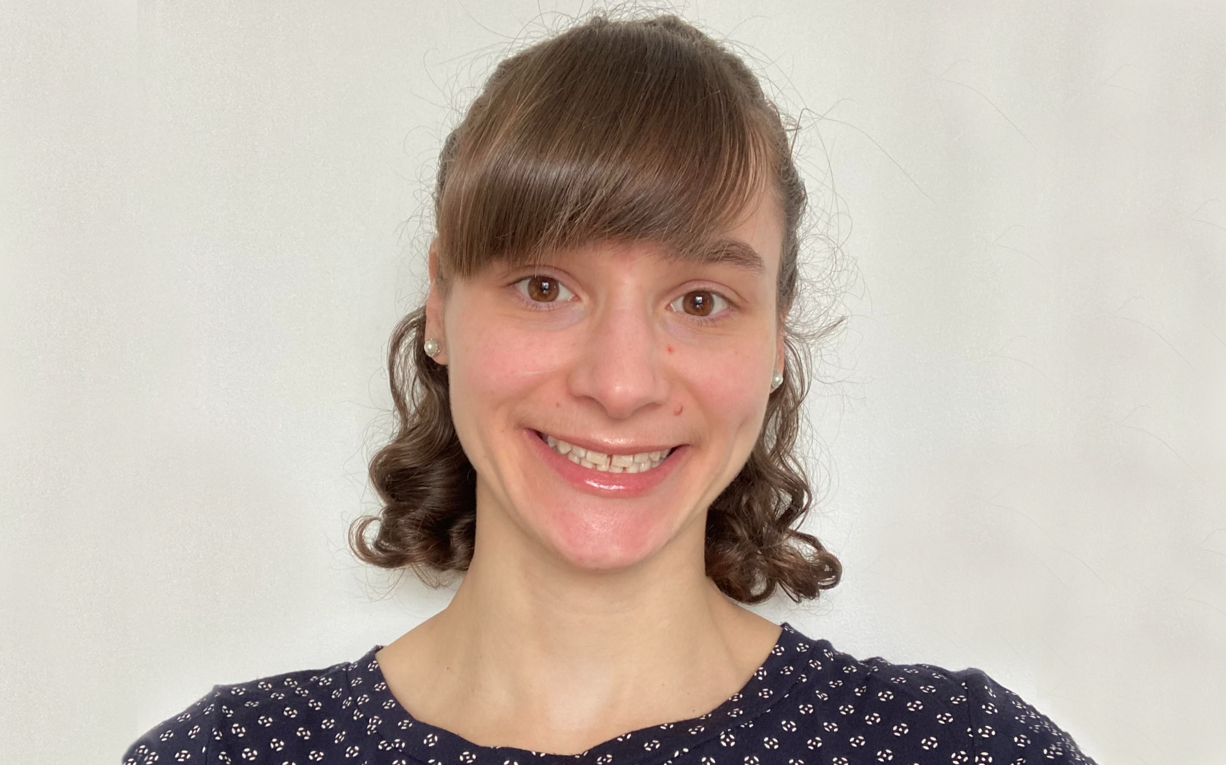 A head and shoulders portrait shot of Dr Arianne Babina