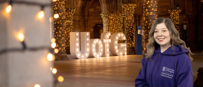 UofG light up sign in the cloisters with fairy light alongside a headshot of Sami