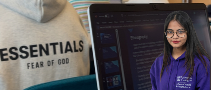 Laptop screen open with headshot of smiling woman