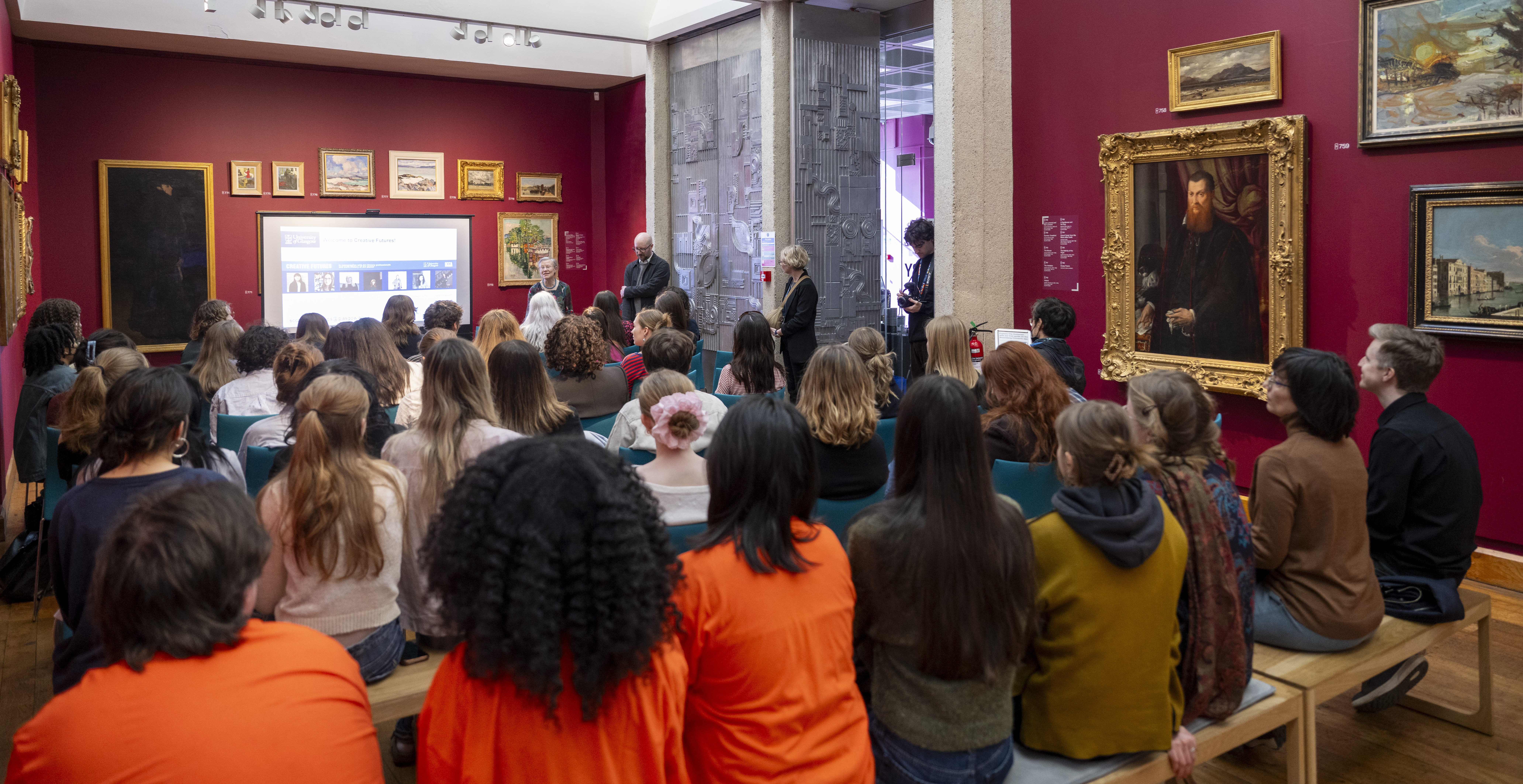 An audience watching a History of Art presentation at the Hunterian Art Gallery