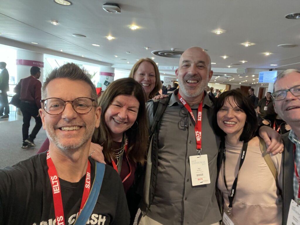 Dr Neil McMillan  in an informal group photo with UofG colleagues at IATEFL 2025