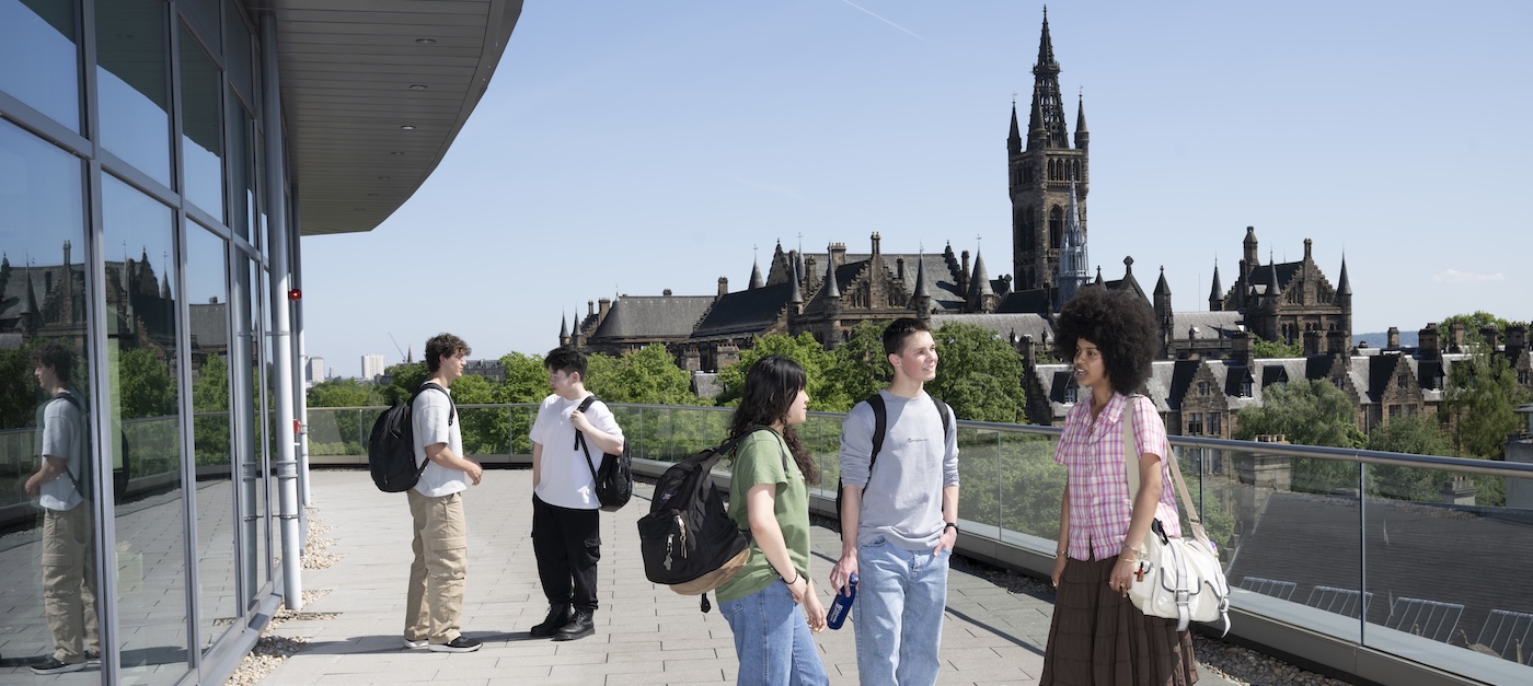Students standing on the deck of the learning hub