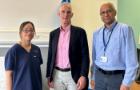 Two clinicians and a patient in a hospital setting