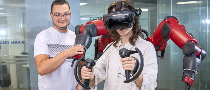 Students using VR headset and controls
