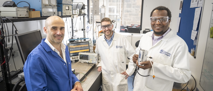 Dr Paul Prentice, Professor Mark Symes, and Dr Lukman Yusuf of the University of Glasgow pose with the £20 prototype device they built to produce nitrate from water and air using ultrasound