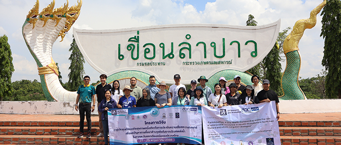 Image of researchers from Chulalongkorn University holding a banner