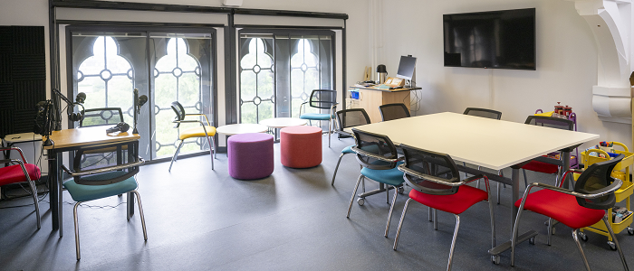 Creative Impact Lab room with tables and chairs
