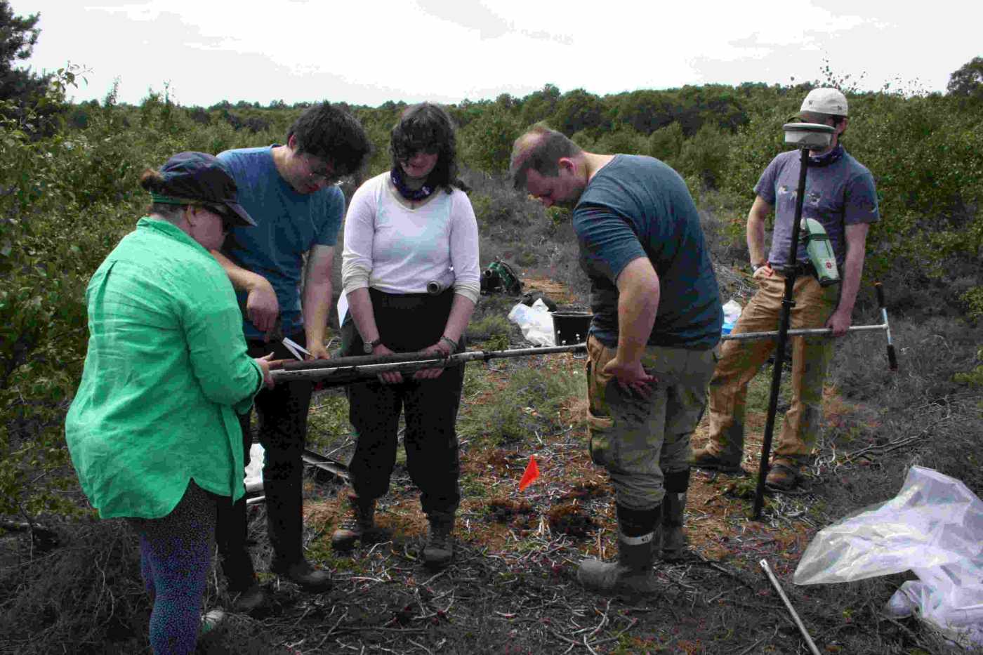 The team taking a sediment core from Hatfield Moors NNR. Left to right: Nicki Whitehouse, Wenguang Tang, Rachel McDonald, Stuart Munro, Luca McCall. Photo credit: Alex Skarlatos-Currie.
